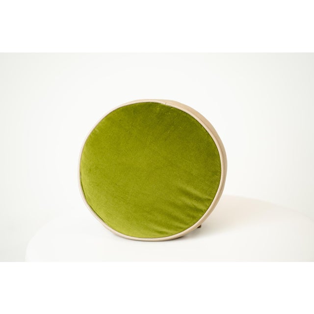 A playful modern accent, this round throw pillow features a bold pinwheel of grass-green and creamy ivory panels. The...