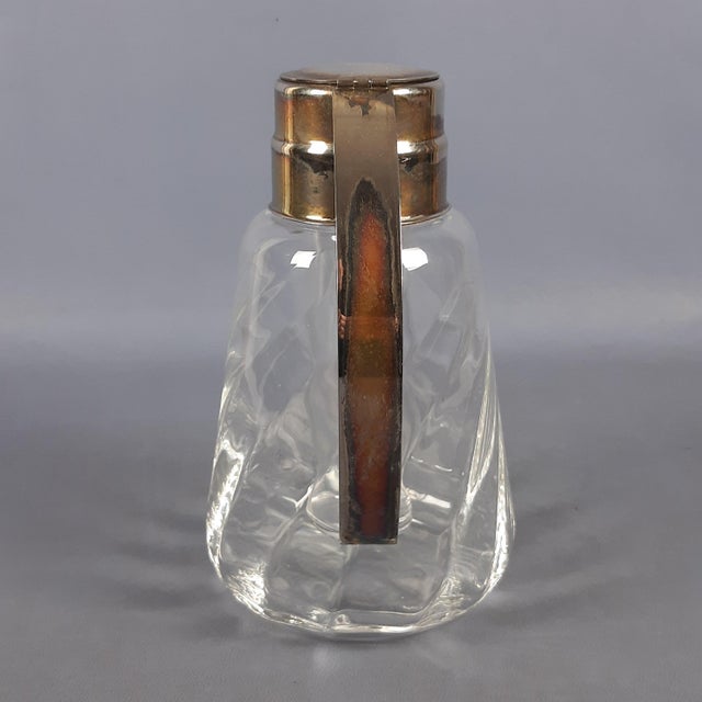 An elegant tableware or bar accessory, a vintage pitcher (or carafe) crafted from a combination of fine materials....