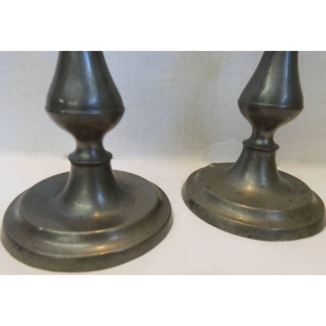 This is a classic pair of pewter candlesticks to grace your surroundings. The smooth lines will look stunning anyway you...