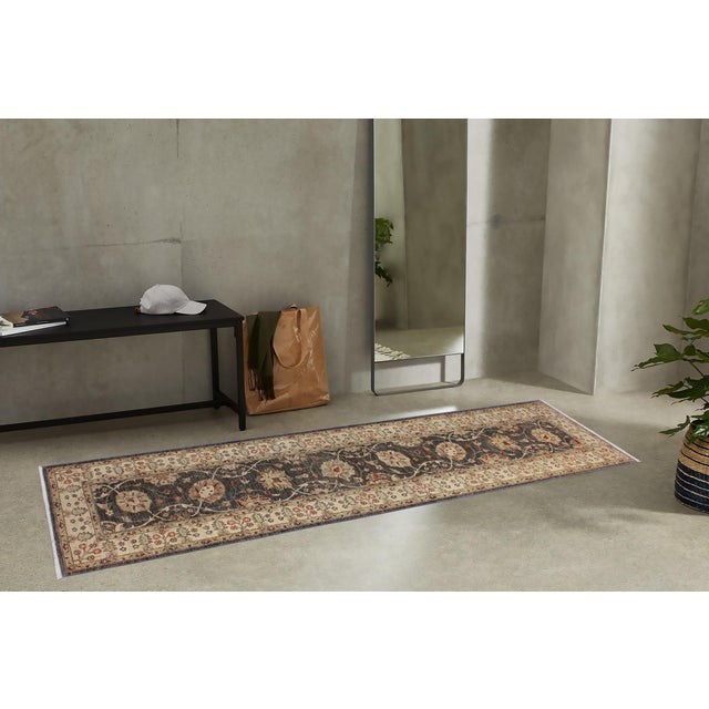 Enhance the ambiance of your home with this magnificent Persian-influenced Turkish hand-knotted rug made by skilled...