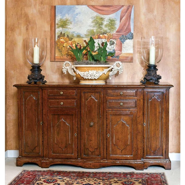 Handcrafted in Italy from solid walnut, this French Provincial style sideboard features a warm distressed finish that...