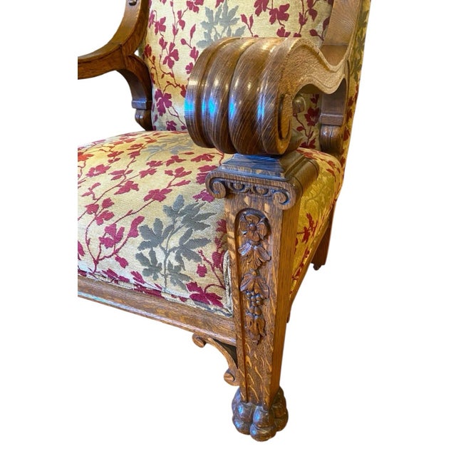 Fantastic Late 19th Century Renaissance Revival hand carved wooded Lions and claw feet and upholstered chair. The chair...
