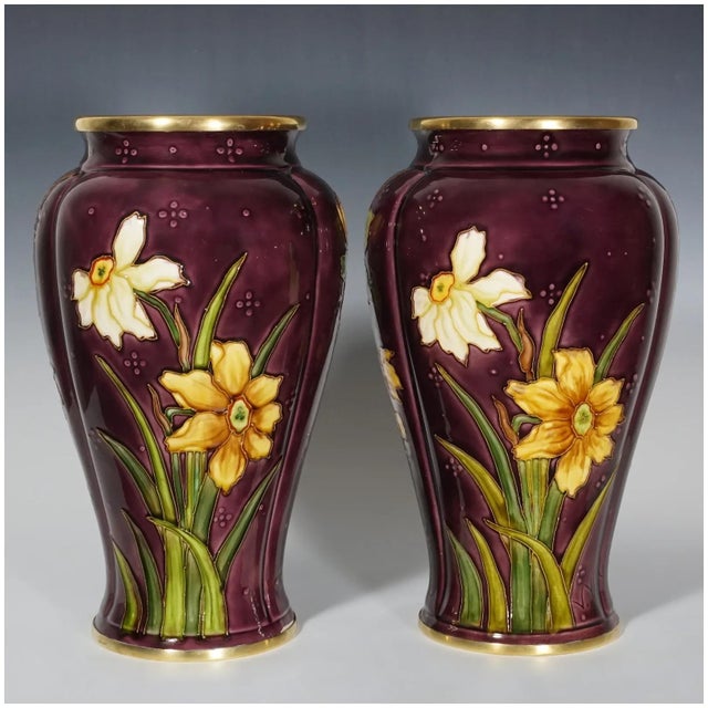 Large pair of French Sevres ceramic vases from the atelier of Optat Milet. The baluster-form vases are decorated with tube...