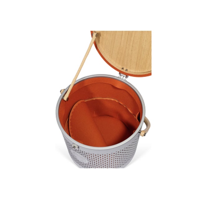Saddle storage box in oak, felt, and aluminum: Chrome-plated brass latch. Perforated aluminum body forming a stylized "H"...