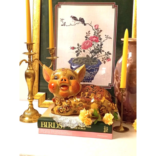 This Chinoiserie porcelain sitting pig figurine introduces a vibrant folk art silhouette and rich mid-century texture to a...