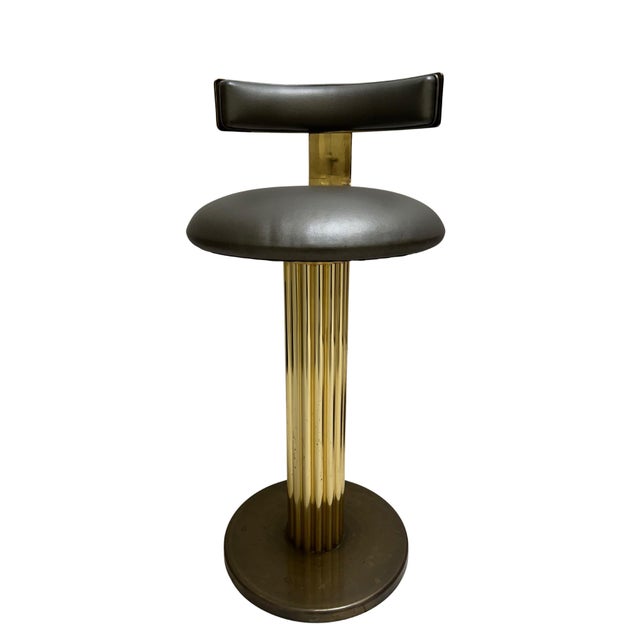 A sophisticated example of Design for Leisure’s iconic style, this barstool pairs rich brown leather upholstery with the...