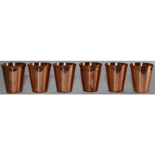 This is an interesting set of copper shot glasses with a unique leather case by West Bend. This set of six shot glasses...