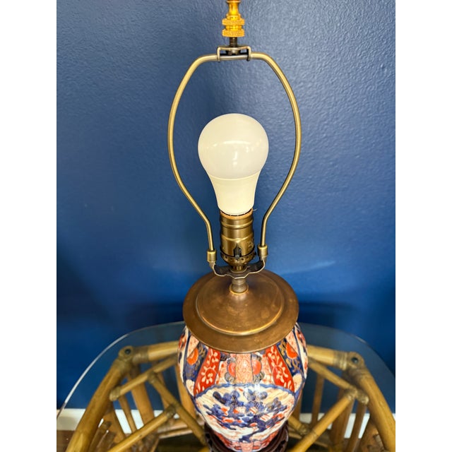 This was an antique urn wired to be a lamp. It has 4 beautiful cherry blossom motifs around it and is in wonderful...