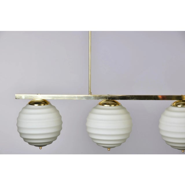 New Italian Fixture With 4 Pale Taupe Globes on Horizontal Brass Bar For Sale - Image 9 of 12