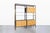 This stunning mid-century modern freestanding wall unit is a true masterpiece designed by John Stuart and crafted by West...