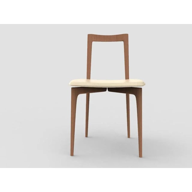 with its light and solid wood structure, this chair is suitable for contemporary interiors. Its proportions and reduced...