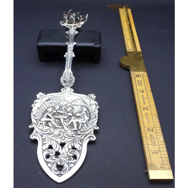 This fabulous Dutch pie or cake server is created in gorgeous silver plate and has a very intricate rococo design with men...
