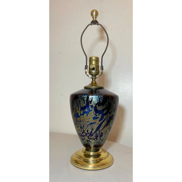 Add a touch of vintage charm to your home decor with this stunning hand blown studio glass table lamp. The lamp features a...