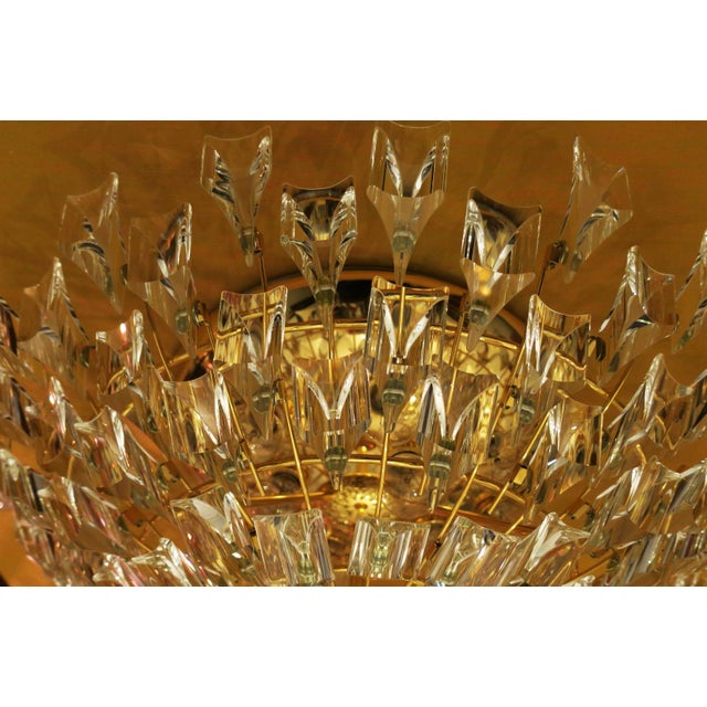 Magnificent flush mount chandelier by Stilkronen, Italy dating from about 1970, with a multitude of cut glass shapes on a...