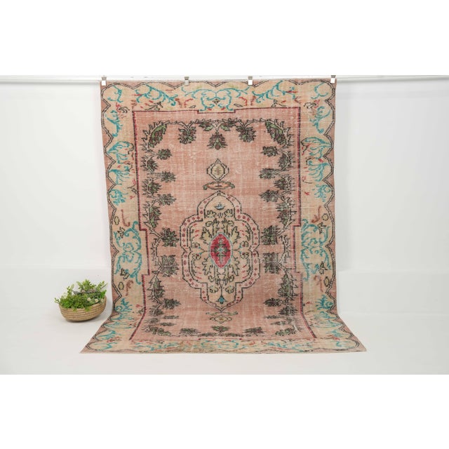Vintage Hand-Knotted runner rug is a semi-antique vintage area rug. The '70s Eastern region of Anatolia's unique rug is...