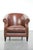 This beautiful and comfortable cognac-coloured cowhide leather club armchair in English style features a loose seat...