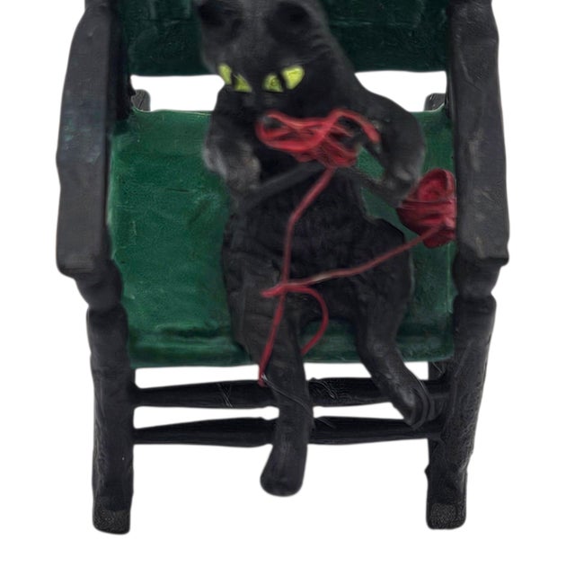 This early 20th-century Austrian cold-painted bronze depicts an anthropomorphic cat seated in a rocking chair while...