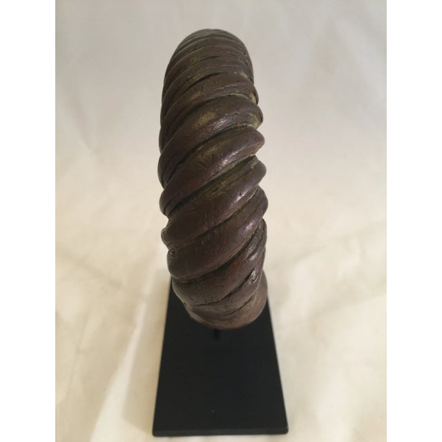 A substantial mounted West African prestige bracelet in bronze worn by a high-ranking member of society. Beautiful patina...