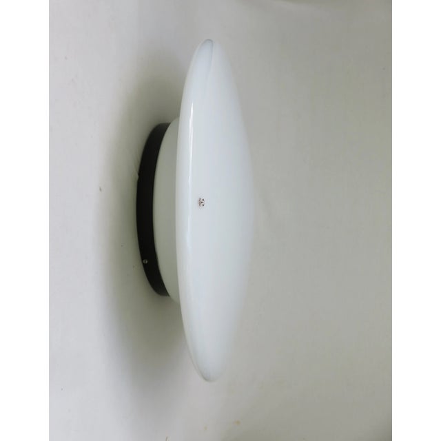 - a very large ufo ceiling light - dates from the 70s - produced by peill & putzler - can very well be used as a wall lamp...