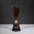 ABOUT An original Art Deco brass and copper plated cup trophy with a Bakelite base. Original metal maker's tag. CREATOR...