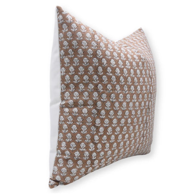 Add a wave of artisanal charm to your décor with this block print handmade cushion cover in the graceful "Tarangini"...
