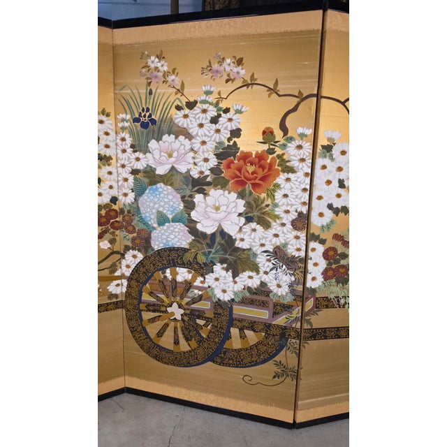 Elegant antique Japanese four-panel byōbu folding screen featuring a beautifully hand-painted Hanaguruma (Flower Cart)...