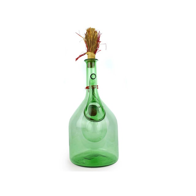 This vintage hand-blown green glass chiller decanter (or porrón) is a charming marriage of rustic Mediterranean tradition...