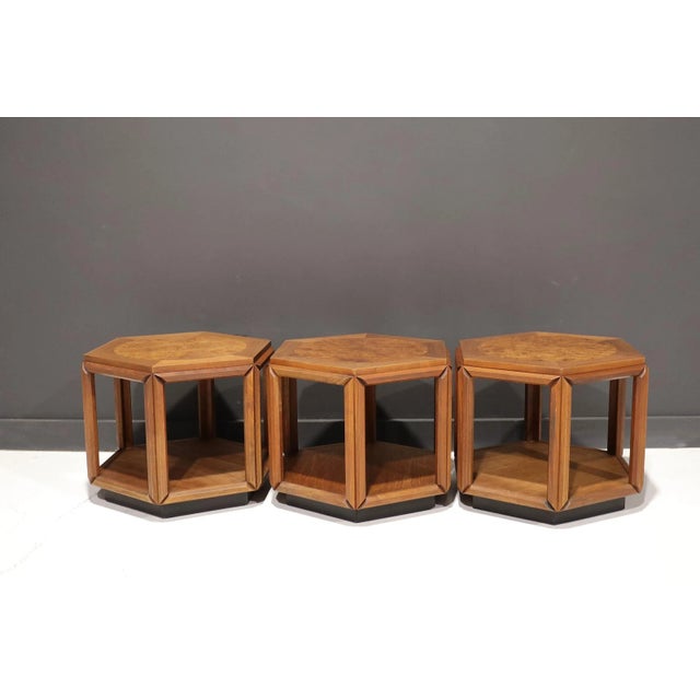 Set of three hexagonal shape side tables design by John Keal for Brown Saltman in the 1970’s. Constructed of walnut with a...