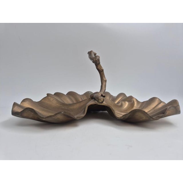 Decorative and functional leaf-shaped bowl in solid brass, France early 1900s. Whimsical Art Nouveau style with flowing...