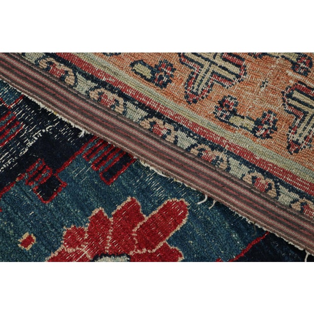 Made with hand-knotted wool circa 1890-1900, this 3x6 antique Persian runner rug is an extremely rare and exciting new...