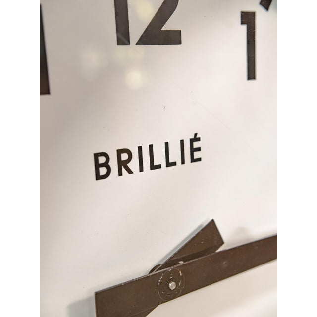 Authentic double-sided station clock by Brillié (France), carefully restored while preserving its original industrial...