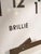 Authentic double-sided station clock by Brillié (France), carefully restored while preserving its original industrial...