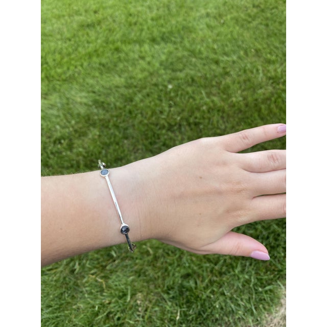 Stones: hematite and clear quartz doublet Length: 7.75 in. Width: 6.5 mm (at widest) Weight: 6.2 dwts. / 9.6 grams Stamps:...