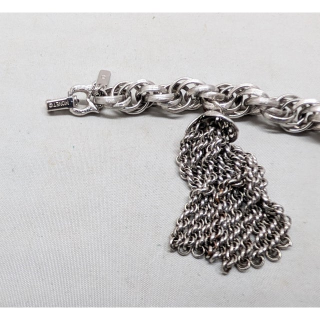 Silver Vintage 1960s Signed Monet Rhodium Plated Tassel Charm Bracelet For Sale - Image 8 of 8