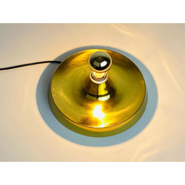 An exceptional wall lamp by cosack. The lamp is from the 1960s and made in germany. The body of the lamp is made of brass....