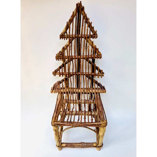 Charming vintage twig chair with an expressive fan-shaped back, woven seat, and wonderfully organic handmade construction....
