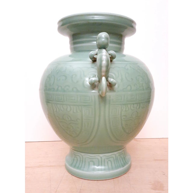 Chinese porcelain celadon dragon handled vase, a band of archaic stylized dragons above the waist, a band of Ru Yi...