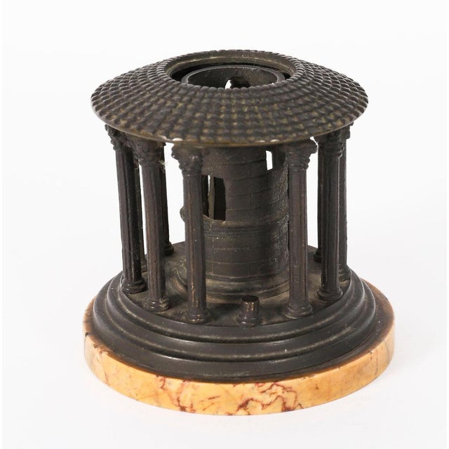 A delightful Italian bronze Grand Tour model of the Temple of Hercules Victor, Rome, circa 1860 in date. The bronze...