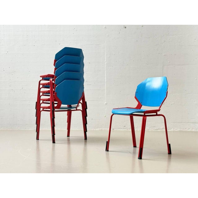 Characteristic stackable chairs from industrial mass production with a contrasting color scheme. The seat and backrest are...