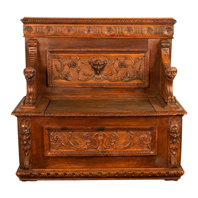 A fine antique Italian Renaissance Revival carved walnut settle or bench, circa 1880. The bench having a carved gallery...