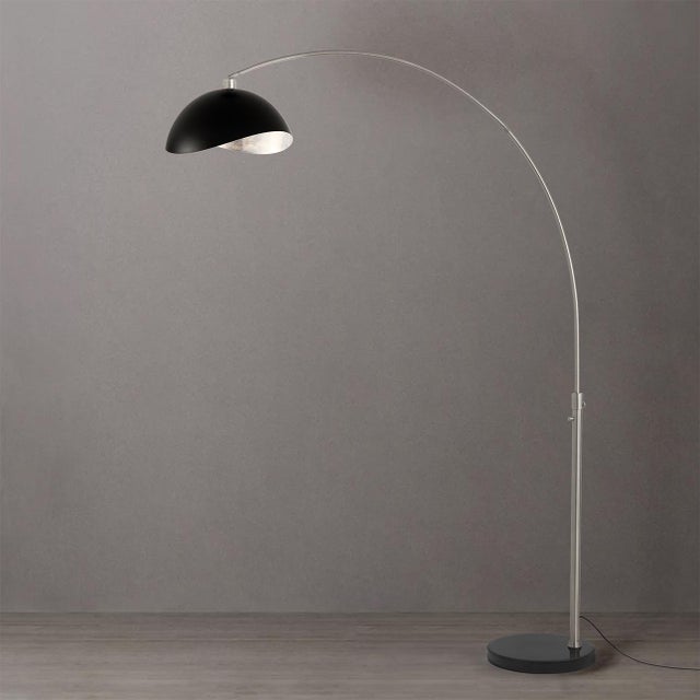 The Luna Bella Arc Lamp is a modern masterpiece designed by Peter Morelli in 1960. This elegant arc lamp features a...