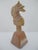 Carved Aztec Mayan Indian chief in headdress figurine. Polished stone in multi-tones of pink, tan, and cream. Measures 5"...