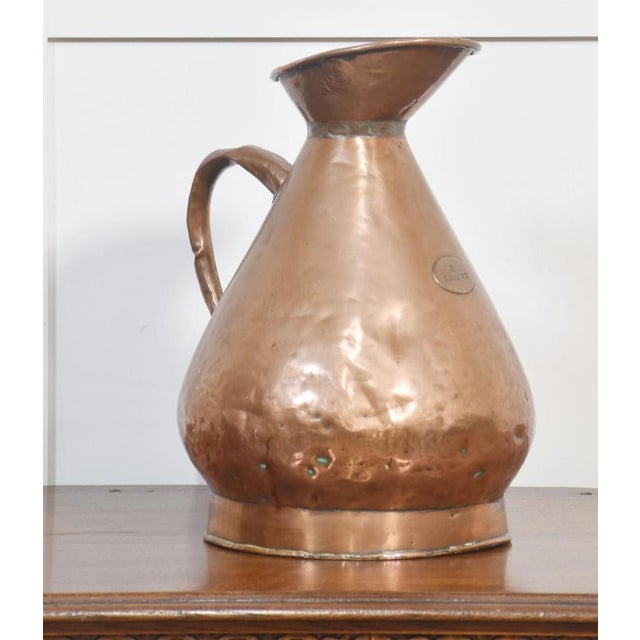 19th Century copper haystack measure with embossed two-gallon label on the front. Dimensions Height 16 Inches Width 10.5...