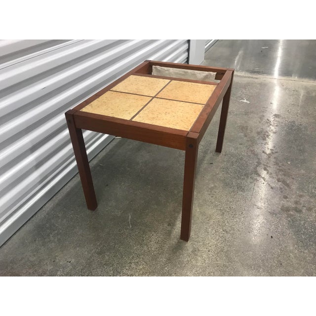 80s teak magazine rack side table with top tile ,with hanging canvas fabric in sling form to hold the magazines.