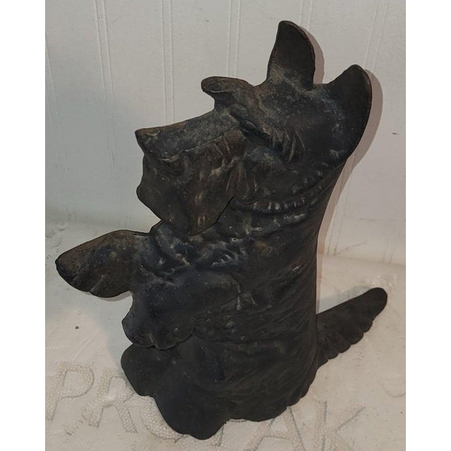19Thc Cast iron Scottie dog door stop in old surface paint.This is a heavy and tall dog doorstop.