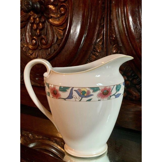 Graceful lines characterize this rare vintage 'Pareek' yellow & pink flower border 'Chamonix' by Johnson Brothers ceramic...