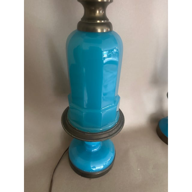 Opaline glass has an unsual milky quality, not found often in production today. The lamps are matched, with tall finials,...