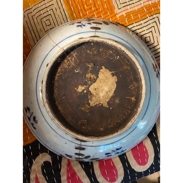 Antique Chinese blue and white dragon porcelain plate. Floral motifs on underside rim. Likely Kangxi (1662-1723) or...