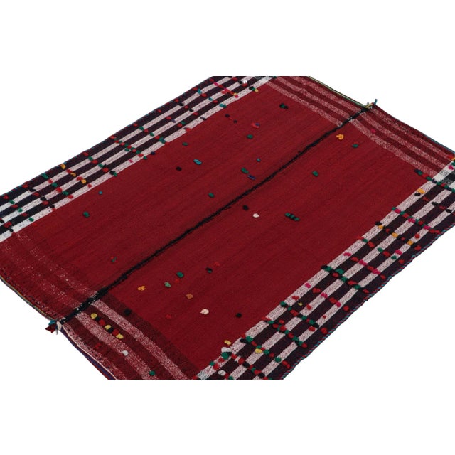 This vintage 5x5 Persian kilim is believed to be a mid-century tribal rug, handwoven in wool circa 1950-1960. On the...