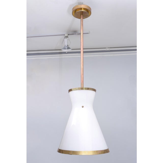 Bespoke Cone-shaped white glass fixture with applied brass.